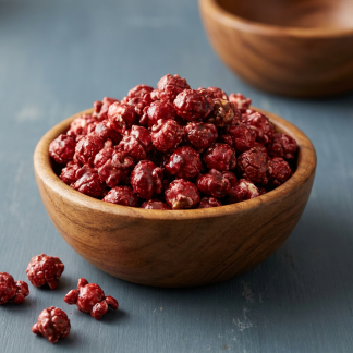 Popstarz Popcorn Red Velvet gourmet popcorn in a wooden bowl